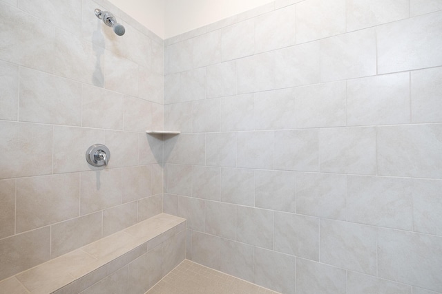 full bathroom with tiled shower