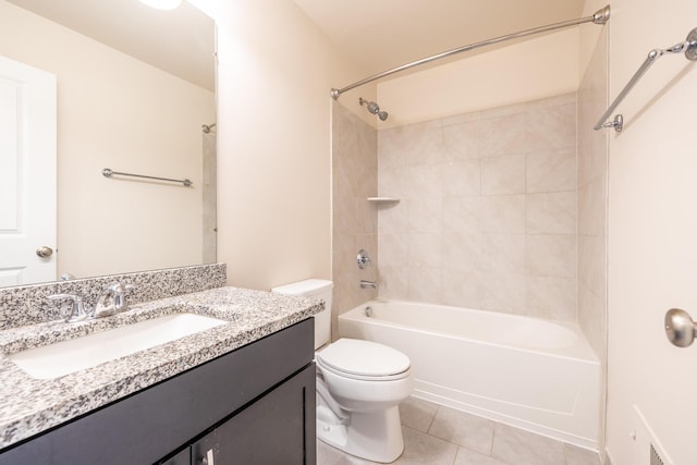 bathroom featuring toilet, bathing tub / shower combination, tile patterned flooring, and vanity