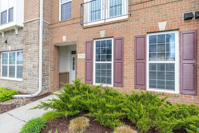 property entrance with brick siding