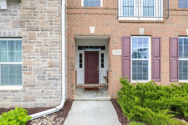 property entrance with brick siding