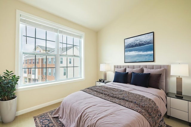 bedroom featuring baseboards, vaulted ceiling, multiple windows, and carpet