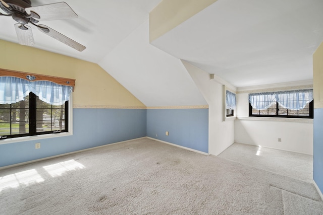 8577 Glenwood Ct, Jackson, MI 49201 - additional living space featuring baseboards, carpet flooring, ceiling fan, and vaulted ceiling