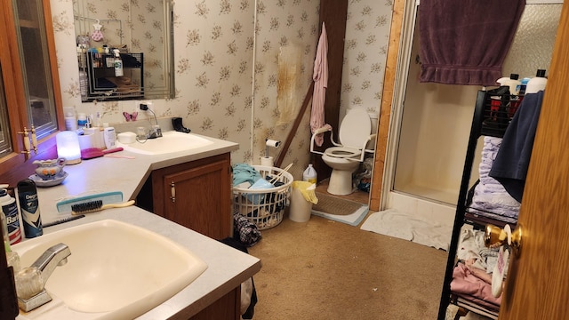 2513 Moore Dr, Allegan, MI 49010 - full bathroom with toilet, wallpapered walls, vanity, and a shower with shower door