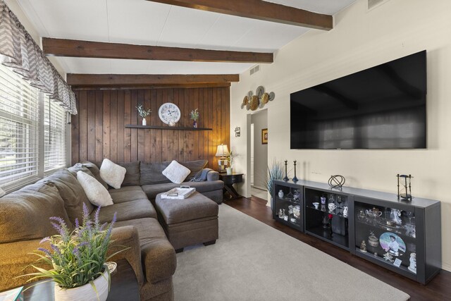 1560 S Carlson St, Westland, MI 48186 - living area with wooden walls, beam ceiling, wood finished floors, and visible vents