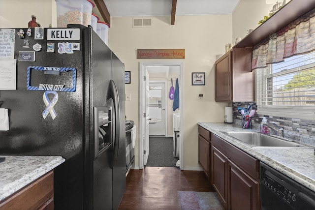1560 S Carlson St, Westland, MI 48186 - kitchen with a sink, light countertops, dark wood finished floors, visible vents, and black appliances