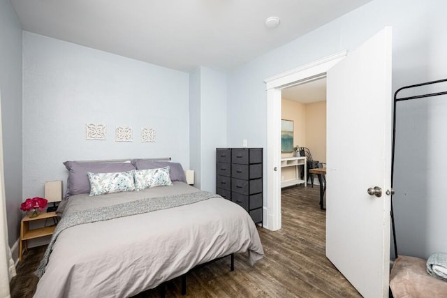 bedroom featuring wood finished floors