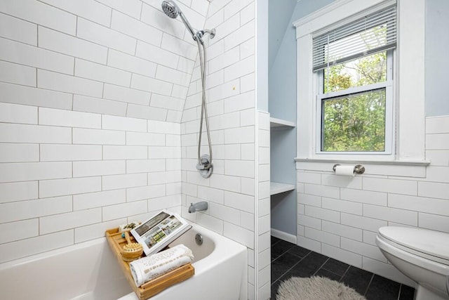 full bathroom featuring a healthy amount of sunlight, tile walls, toilet, and tub / shower combination