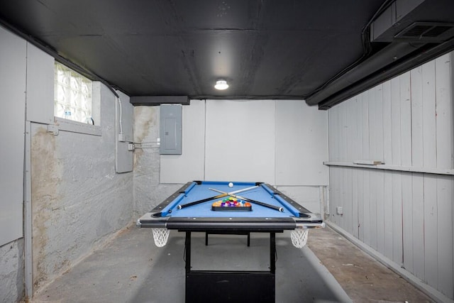 rec room featuring pool table, unfinished concrete flooring, and electric panel