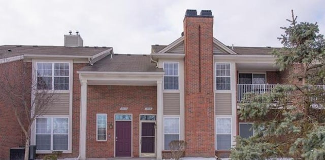 view of building exterior with central air condition unit