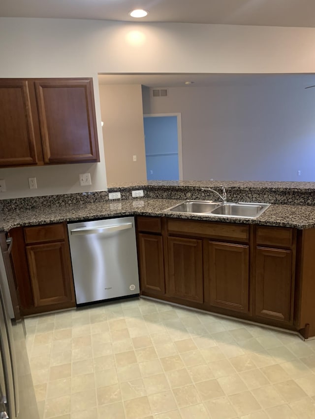kitchen with a sink, dishwasher, dark stone countertops, recessed lighting, and visible vents