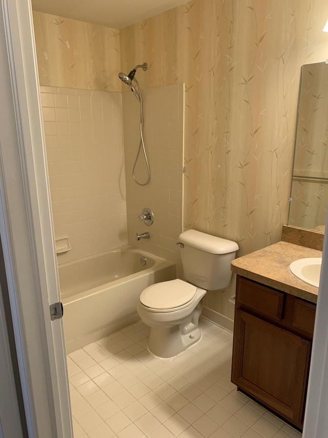full bath featuring shower / tub combination, vanity, tile patterned floors, toilet, and wallpapered walls
