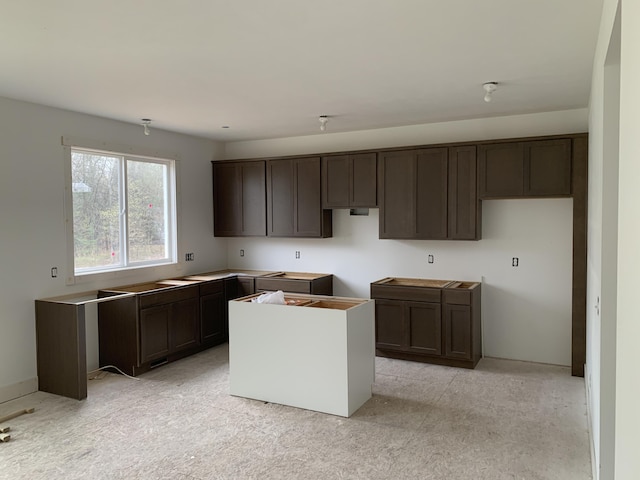 3112 Thornbury Dr, Holland, MI 49424 - kitchen featuring dark brown cabinetry