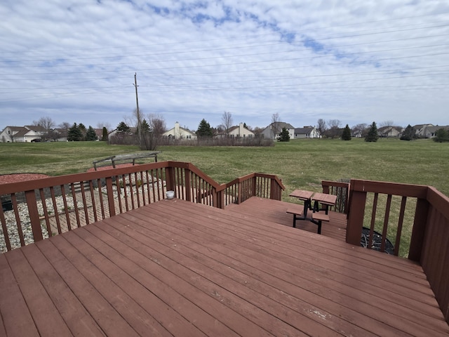 deck with a lawn and a residential view