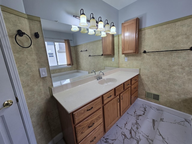 bathroom featuring visible vents, marble finish floor, and vanity
