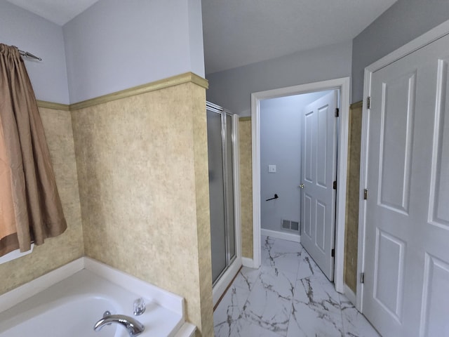 full bathroom featuring visible vents, a garden tub, marble finish floor, and a stall shower