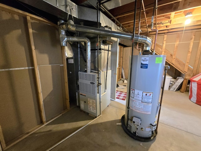 utility room featuring heating unit and water heater