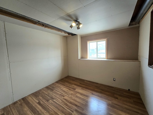spare room featuring wood finished floors
