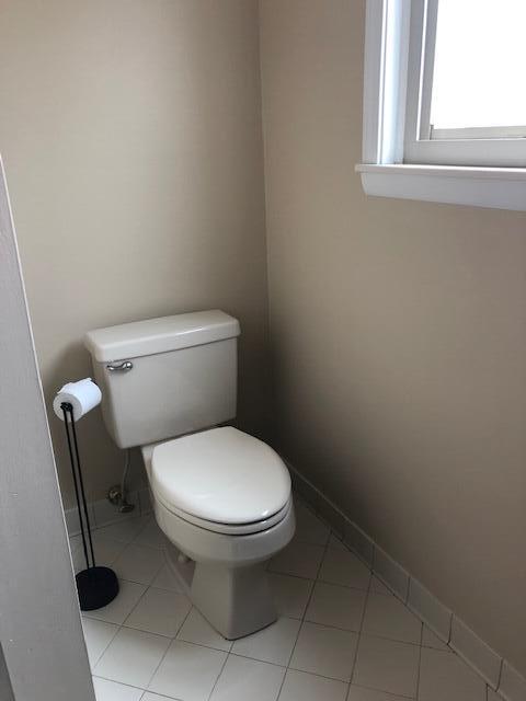 bathroom featuring tile patterned flooring and toilet