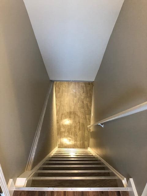 stairs with wood finished floors