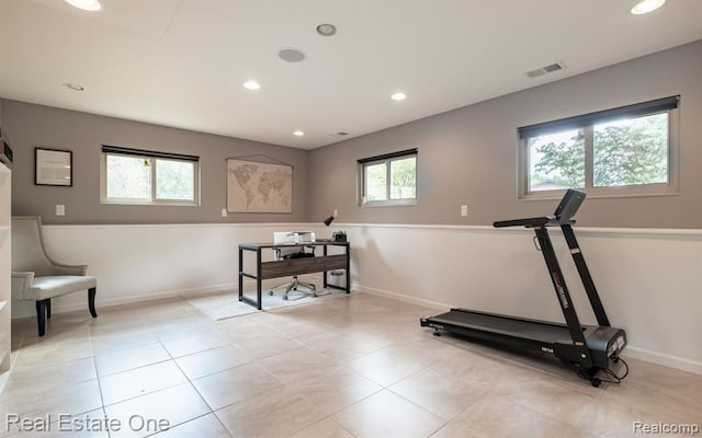 exercise room with recessed lighting, baseboards, visible vents, and light tile patterned floors