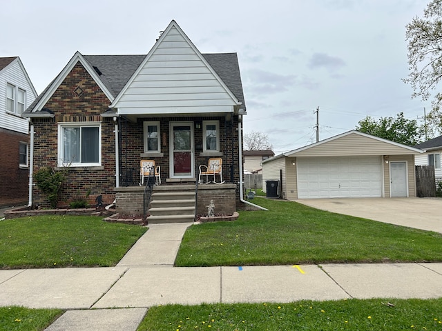 2528 Corbin St, Melvindale, MI 48122 - view of front facade featuring a porch, a front yard, an outbuilding, a garage, and brick siding