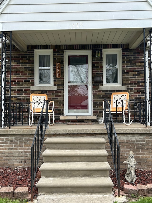 2528 Corbin St, Melvindale, MI 48122 - property entrance featuring covered porch and brick siding
