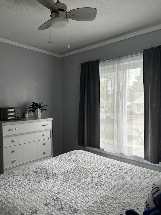 2528 Corbin St, Melvindale, MI 48122 - bedroom featuring ceiling fan, ornamental molding, and a textured ceiling