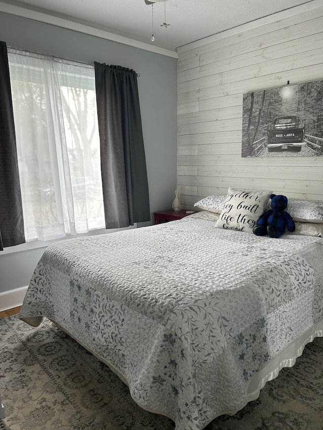 2528 Corbin St, Melvindale, MI 48122 - bedroom with crown molding, wood walls, and wood finished floors