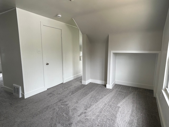 2528 Corbin St, Melvindale, MI 48122 - bonus room featuring baseboards, visible vents, and dark colored carpet
