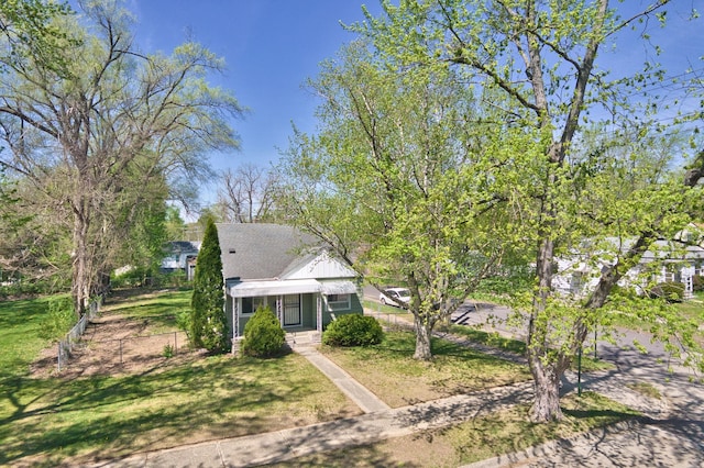 bungalow-style house with a front yard