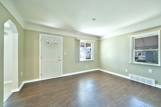entryway featuring dark wood finished floors and baseboards