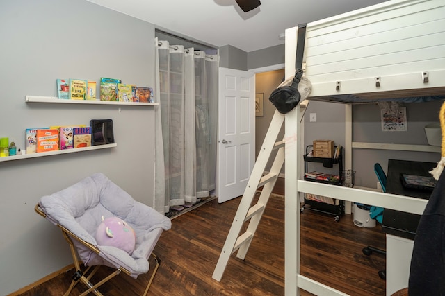 bedroom with a ceiling fan and wood finished floors
