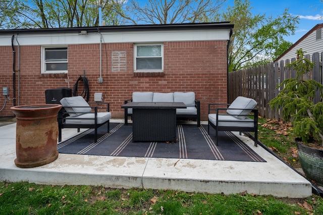 view of patio with outdoor lounge area and fence
