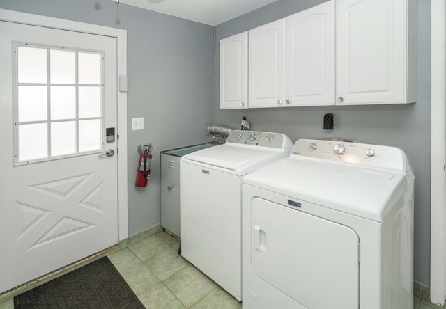 washroom featuring cabinet space, independent washer and dryer, and baseboards
