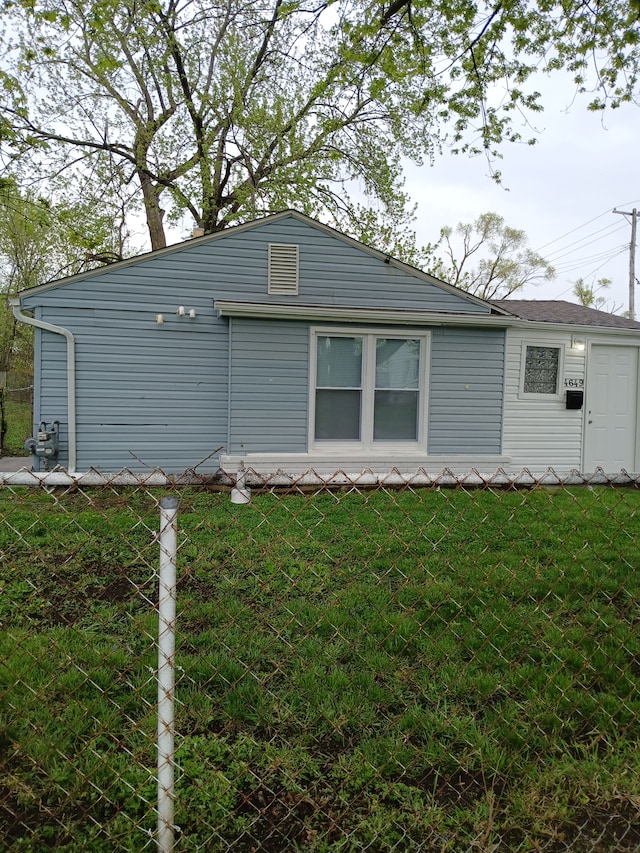 view of property exterior featuring a yard