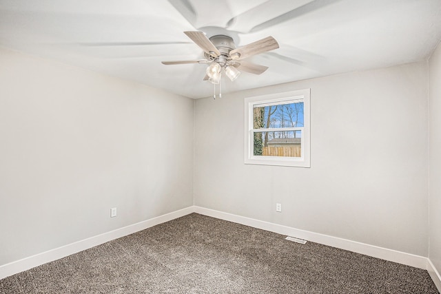 785 Maple Dr, Columbiaville, MI 48421 - empty room featuring baseboards, ceiling fan, dark carpet, and visible vents