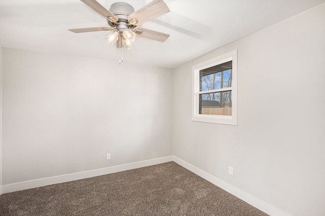 785 Maple Dr, Columbiaville, MI 48421 - spare room with dark carpet, a ceiling fan, and baseboards