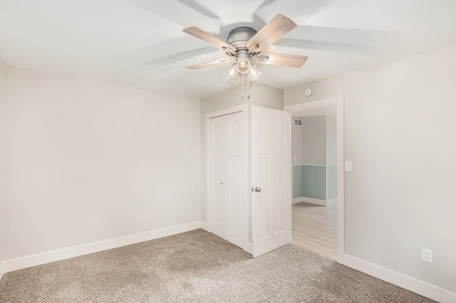785 Maple Dr, Columbiaville, MI 48421 - unfurnished bedroom featuring baseboards, visible vents, light carpet, and a closet
