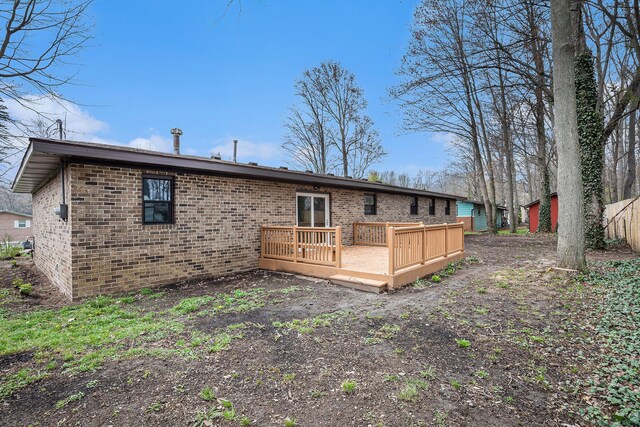785 Maple Dr, Columbiaville, MI 48421 - back of property featuring brick siding and a wooden deck