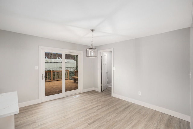 785 Maple Dr, Columbiaville, MI 48421 - empty room with light wood finished floors and baseboards