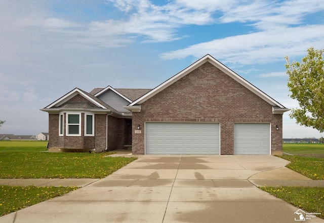 ranch-style house with a garage, concrete driveway, a front yard, and brick siding