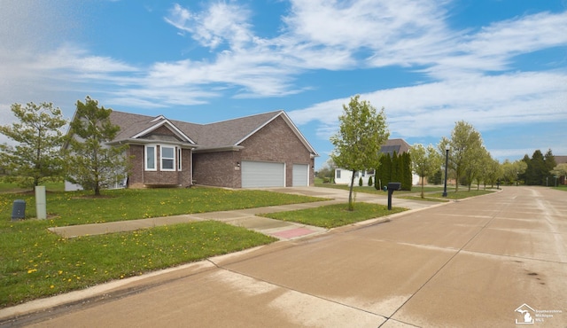 view of front facade featuring a garage, driveway, a front lawn, and brick siding