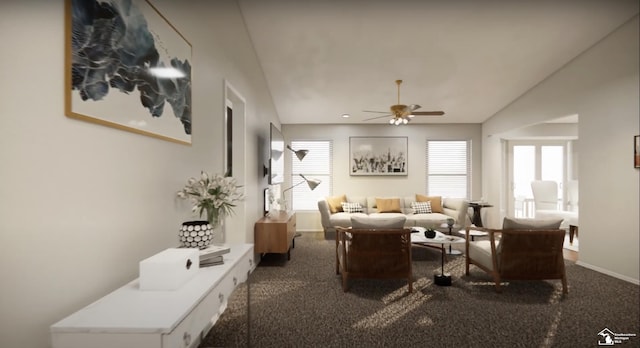 living area featuring ceiling fan, vaulted ceiling, baseboards, and carpet