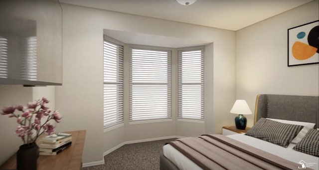 bedroom with carpet floors and baseboards