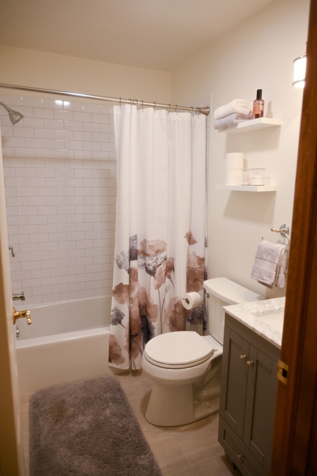 bathroom featuring vanity, toilet, and shower / bath combo
