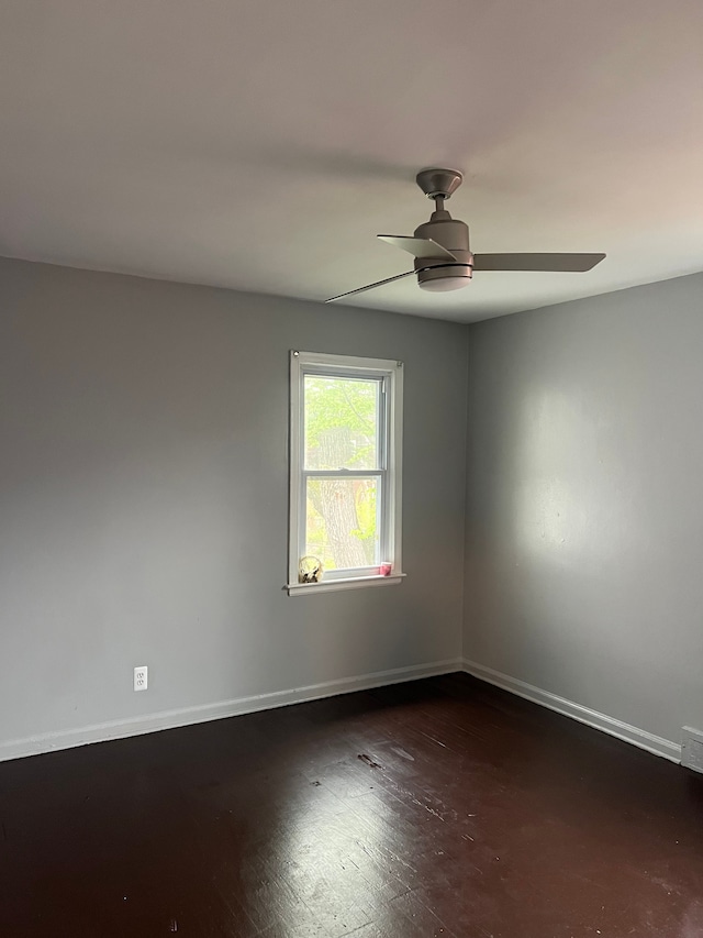 15758 Hubbell St, Detroit, MI 48227 - empty room with a ceiling fan, baseboards, and wood finished floors
