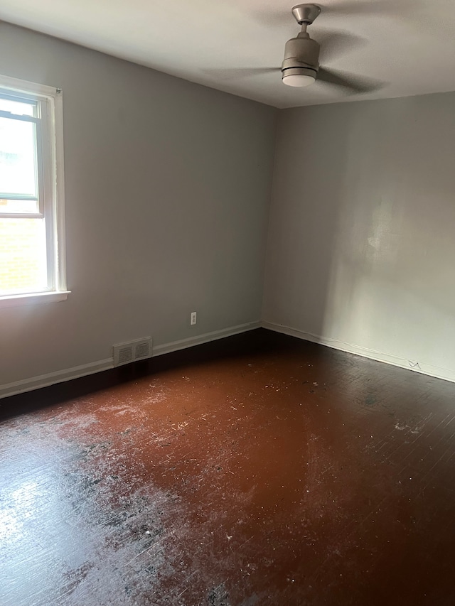 15758 Hubbell St, Detroit, MI 48227 - unfurnished room featuring ceiling fan, baseboards, and concrete floors