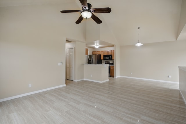 unfurnished living room featuring a ceiling fan, baseboards, light wood-type flooring, and high vaulted ceiling