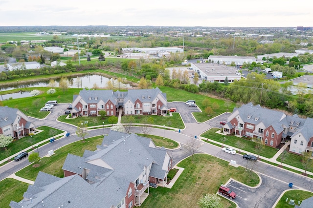aerial view with a water view and a residential view