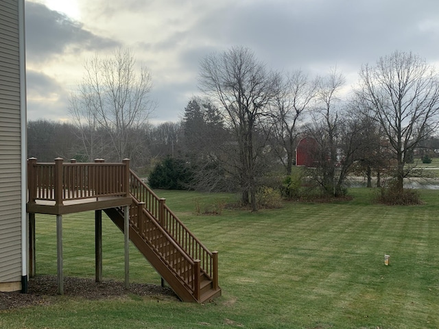 view of yard featuring stairway and a deck